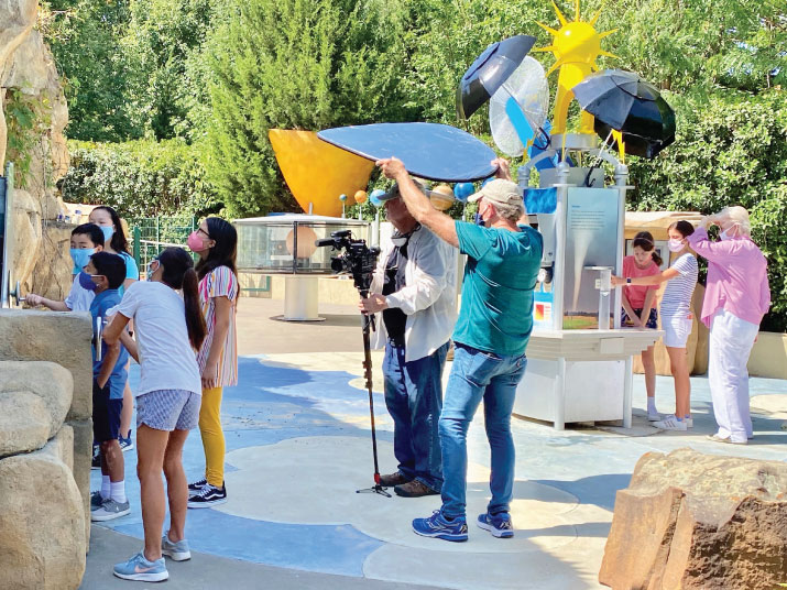 Students and their teacher are filmed while learning about water cycles